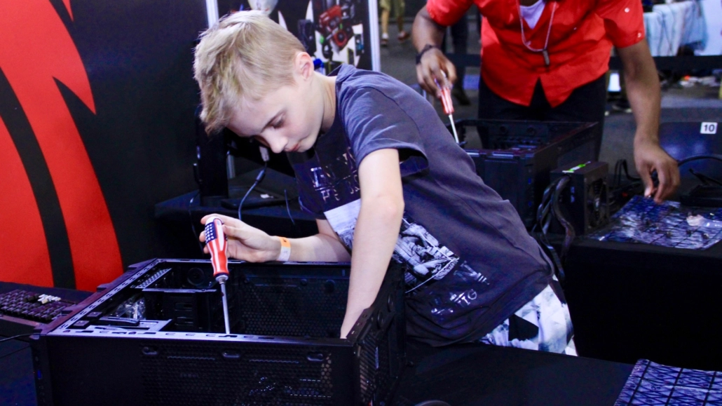Kid building a PC at the MSI Gaming PC Workshop